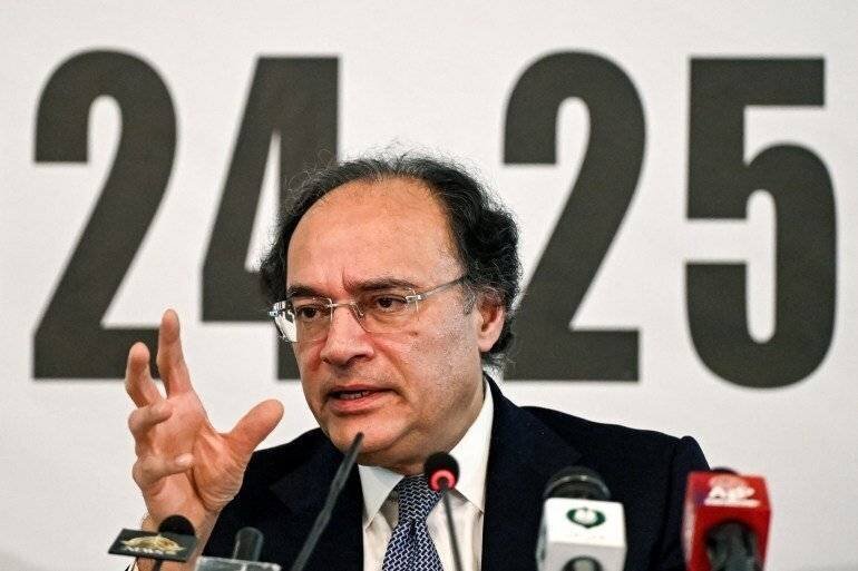 Minister of Finance Muhammad Aurangzeb addresses investors in Islamabad.