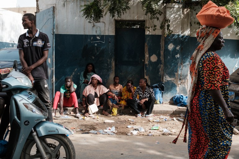 Relatives wait outside the Rebeuss prison for those detained in connection with the recent wave of unrest to be released in Dakar on February 19, 2024.