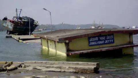 A flooded coastal jetty in Port Blair