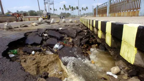 Partly-collapsed beach side street in the vicinity of Port Blair