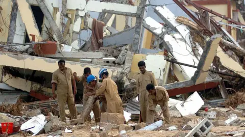 Indian airforce personnel attempt to uncover documents in Malacca on Car Nicobar Island