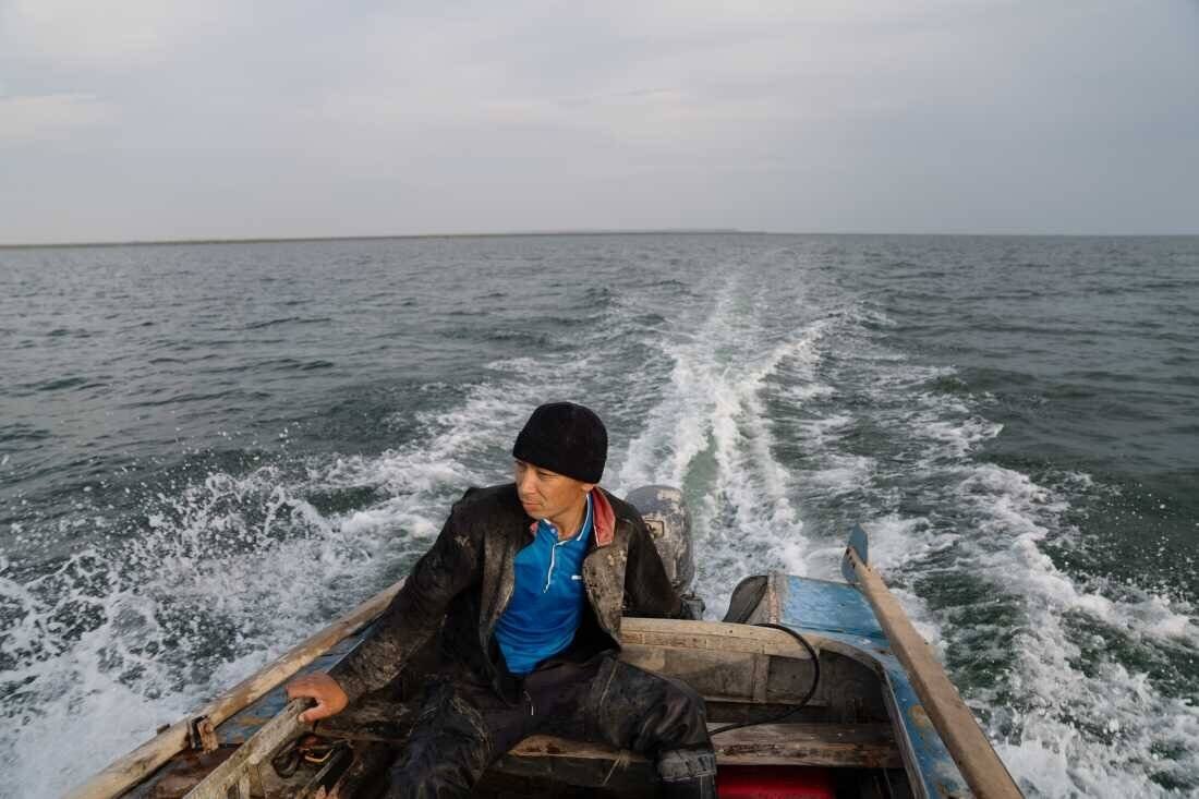 Omerserik Ibragimov heads out to put his nets in the water for fish on the Aral Sea in Kazakhstan.