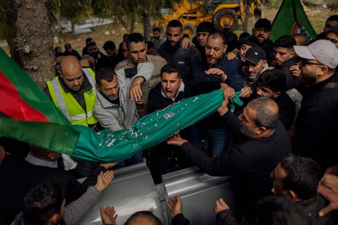 Relatives of Amal Hassan al-Durr, a 5-year-old girl, lay her body to rest at the cemetery in Majdal Zoun, southern Lebanon, on Feb. 22.