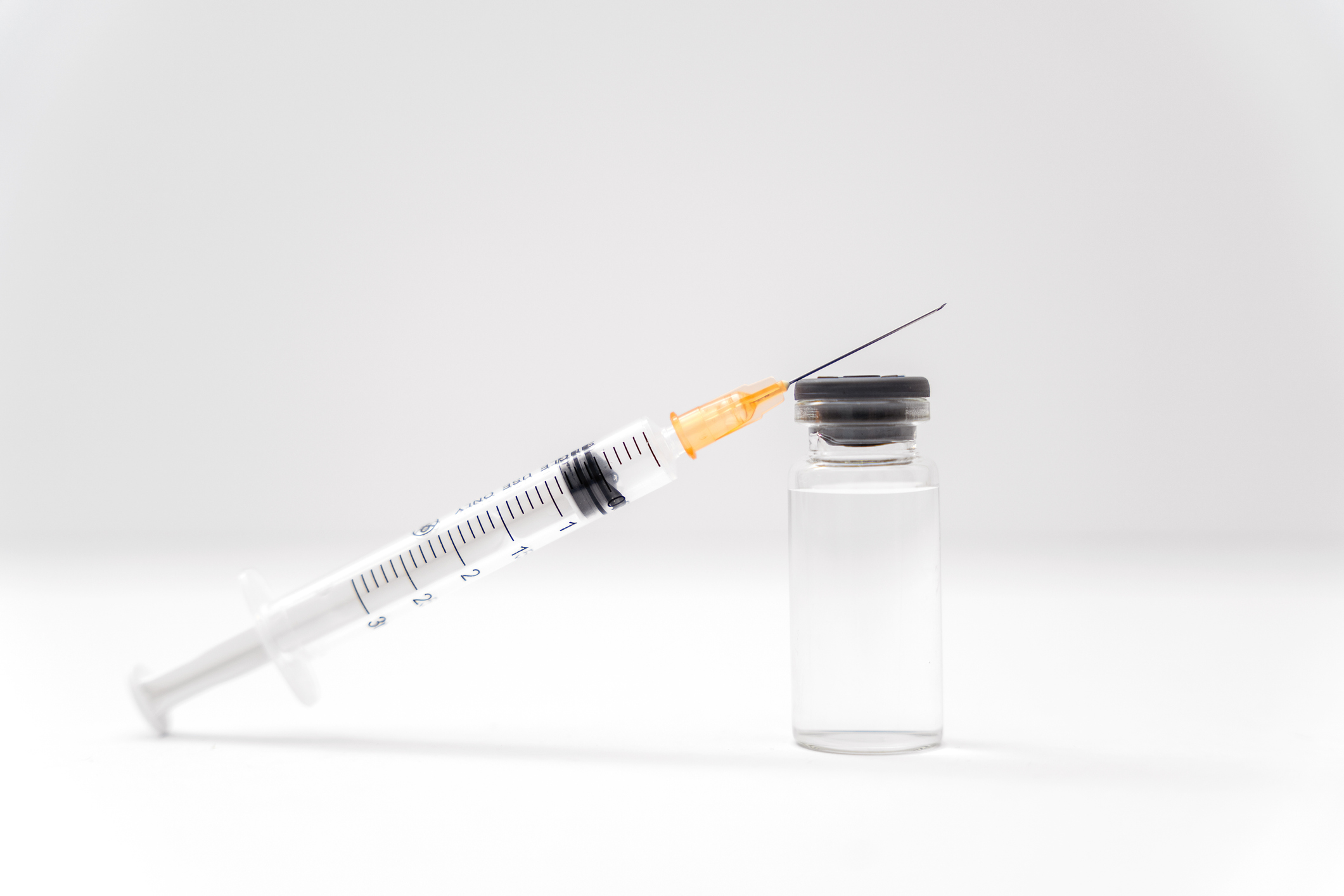 Syringe and Vial on White Background flu shot