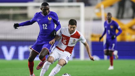 Randal Kolo Muani face à Martin Baturina
