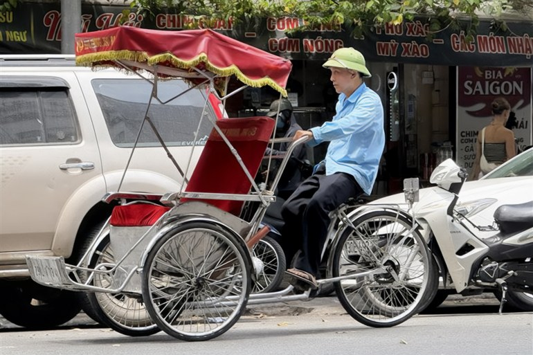 Cyclo à trois roues, emblème des rues de Hanoï