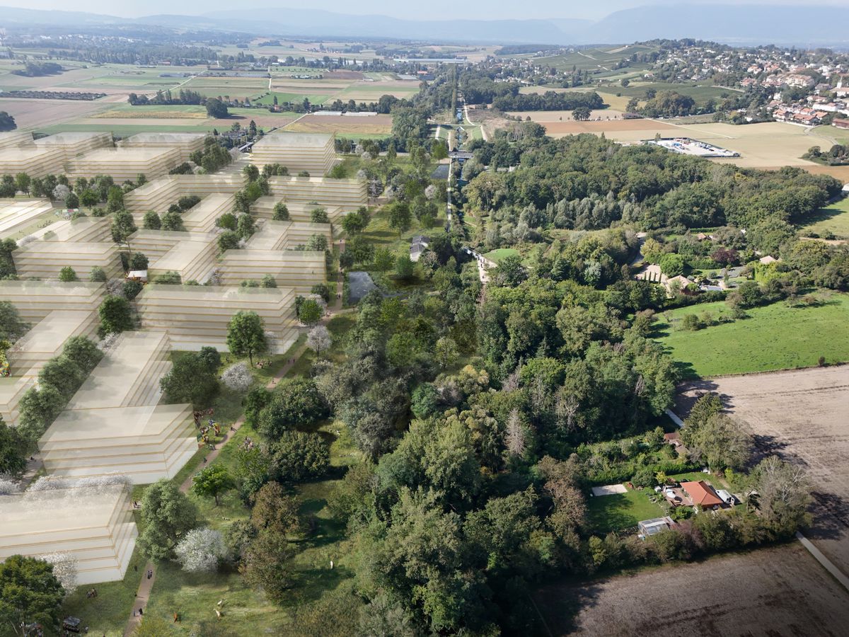 Vue aérienne d’une image de synthèse du projet architectural aux Cherpines, Genève, entouré de champs et de verdure, octobre 2024.
