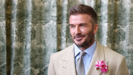 David Beckham, lors d'une rencontre avec le roi Charles III, à Londres, le 19 mai 2025. (TOBY MELVILLE / POOL / AFP)