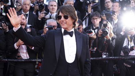 Tom Cruise sur le tapis rouge, avant la projection de 'Mission: Impossible. The Final Reckoning' lors du 78e Festival de Cannes, le 14 mai 2025, à Cannes. (DANIELE CIFALA / NURPHOTO / AFP)