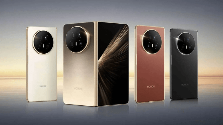 Quatre smartphones Honor Magic V5 de différentes couleurs sur un fond dégradé.