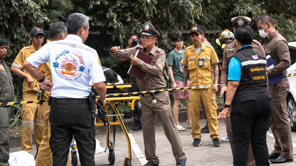 Police thaïlandaise sur les lieux de la fusillade au marché d'Or Tor Kor, Bangkok