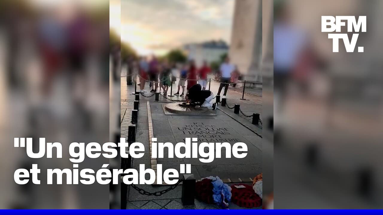 Geste symbolique de l'homme allumant sa cigarette avec la flamme de la tombe du Soldat inconnu