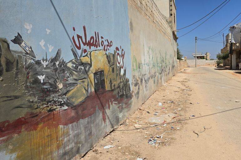 Fresque illustrant les crimes et les conséquences du siège à Gaza