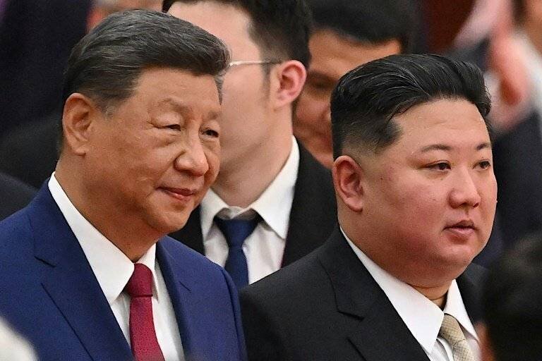 Kim Jong Un et Xi Jinping lors d'une visite à Pékin